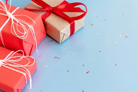 Christmas red and craft gift boxes with white and red ribbons.の写真素材