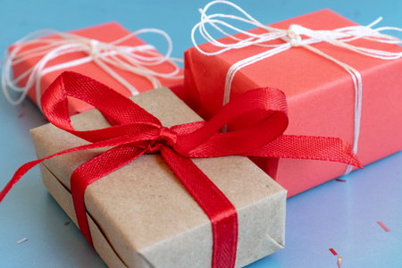 Christmas red and craft gift boxes with white and red ribbons.の写真素材