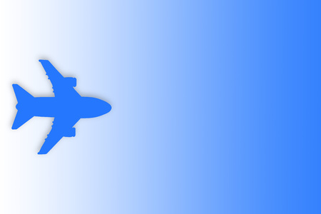 Blue silhouette of plane on blue gradient background with copy space. Travel, journey and flight concept.の写真素材