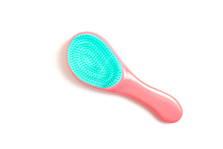 Pink and black hair brush on white background - hairdresser salon and trichology concept.の写真素材