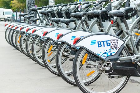 MOSCOW, RUSSIA - AUGUST 02, 2019: A rental bicycles stand in a row on a parking in Moscow.
