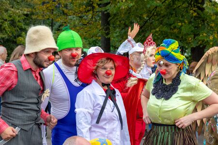 Moscow, Russia - September 14, 2019: Clown festival in the city, clowns in colorful clothes and with a bright makeup communicate with children and make funny facesのeditorial素材