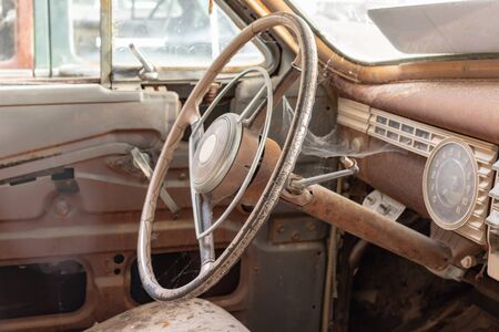 Steering wheel of an old abandoned rusty car.の写真素材