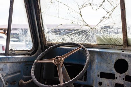 Steering wheel of an old abandoned rusty car.の写真素材