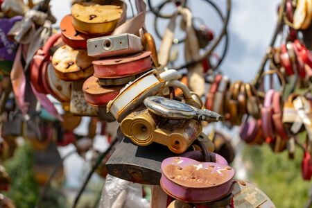 Moscow, Russia - August 03, 2019: Many wedding multicilored locks, castles on a wedding tree as a symbol of eternal love and happiness.のeditorial素材