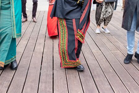 Moscow, Russia - August 02, 2019: Indonesian women wearing traditional clothes dancing together...