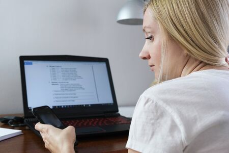 European caucasian business woman freelancer working remotely during quarantine of virus infection,...