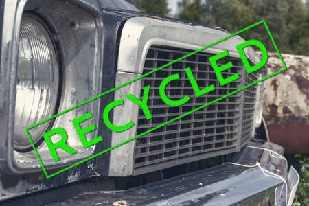 A stamp sign recycled on a part of an old rusty abandoned car, vehicle, environmental protection and...