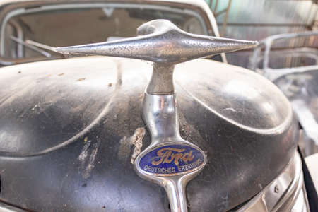 Mozhaisk, Russia - August 11, 2019: Old abandoned rusty vehicles, crushed cars in scrapyard, junk yard needed to be utilised and reused to protect nature and environment, metal recycling conceptのeditorial素材