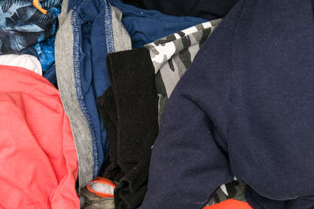 Trash, dirt, mess in the dresser drawer, different clothes, heaps of things