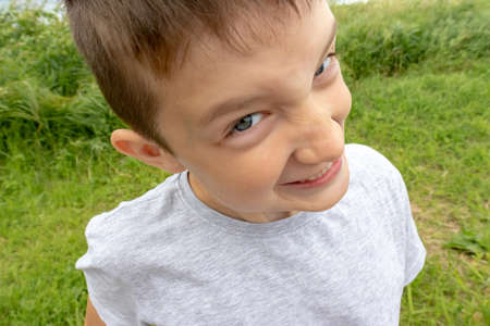 An hyperactive boy making faces, misbehaves and goes crazyの写真素材