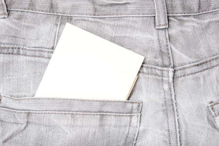 A white blank card in a dark gray worn jeans pocket for text, copy spaceの写真素材