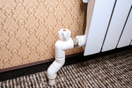 Heat regulation on a heating radiator. Temperature regulator, thermostatic radiatorの写真素材