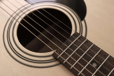 Details of classic acoustic guitar, strings and chords, guitar neck close up.の写真素材