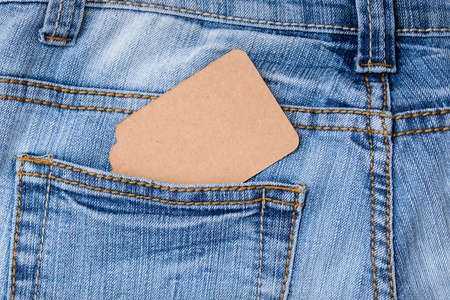 Craft blank label in blue jeans background, sale and discount concept