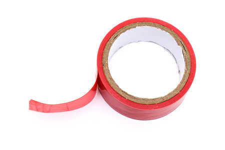 Red roll of electrical sticky isolation duct tape on white backgroundの写真素材