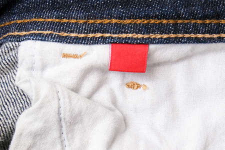 The wrong side, fabric of jeans denim pocket close up, reverse and back side of clothesの写真素材