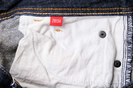 The wrong side, fabric of jeans denim pocket close up, reverse and back side of clothesの写真素材