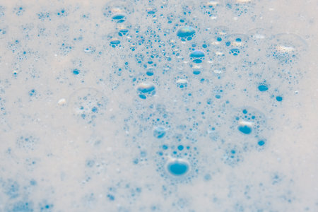 Washing detergent foam with bubbles close up backgroundの写真素材