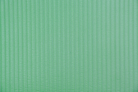 Green striped waved polyurethane foam backgroundの写真素材