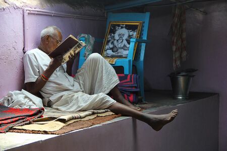 Old man reading holy book, Nilkantheshwar Temple, Panshetのeditorial素材