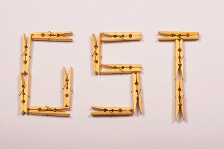 GST letters formed with clothespinsの写真素材