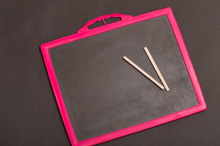 School slate and pencil on itの写真素材