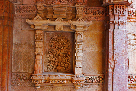 Exquisitely detailed motif in a niche on the side wall . Adalaj Stepwell, Ahmedabad, Gujaratの写真素材