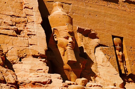 Partial view of two massive rock temples, The twin temples were originally carved out of the mountainside during the reign of Pharaoh Ramesses II in the 13th century BC, as a lasting monument to himself and his queen Nefertariの写真素材