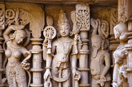 Carved idols on the inner wall of Rani ki vav, an intricately constructed stepwell on the banks of...