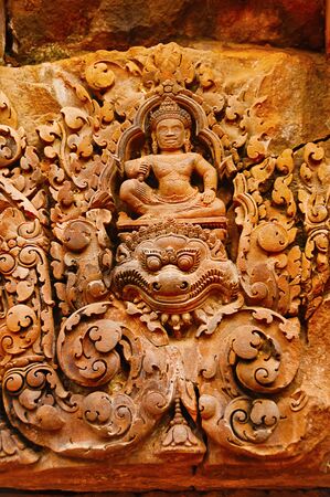 Carvings of gods over a door. Banteay Srei temple, Angkor, Cambodia. The citadel of women, this temple contains the finest, most intricate carvings to be found in Angkor. 967 CE の写真素材