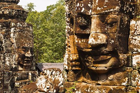 Face towers of the Bayon temple, In the center of Angkor Thom , Siem Reap, Cambodia. Capital city of the Khmer empire built at the end of the 12th centuryの写真素材