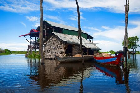 Traditional houses on stilts. Kampong Phluk village Siem Reap, Northern-central Cambodia. Village built on stilts on the Tonle Sap.の写真素材