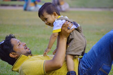 Cute Baby playing with dad ay Pune, Maharashtra.の写真素材