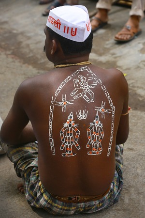 Man with painting on back at Pandharpur festivalのeditorial素材