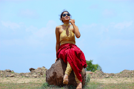 Young woman posing looking at camera sitting and posing