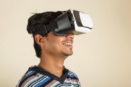 Amazed young boy experiencing virtual reality headsetの写真素材