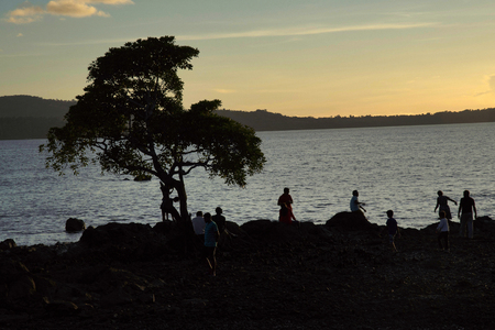 Radhanagar beach, Havelock Island, Andaman islands of many men and women against the setting sun on beach at Chidiya Tapu, Andamanの写真素材