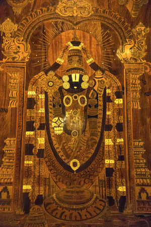 Wooden painting of Lord Tirupathi at hotel lobby, Kumbakonam, Tamil Nadu, Indiaの写真素材