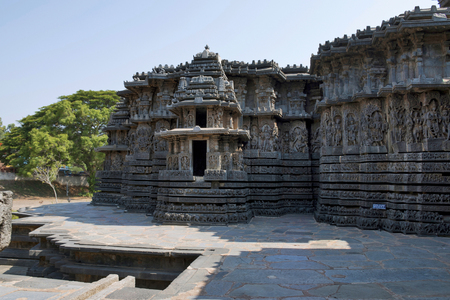 Facade and ornate wall panel relief of the west side, Hoysaleshwara temple, Halebidu, Karnataka, India. View from South.の写真素材