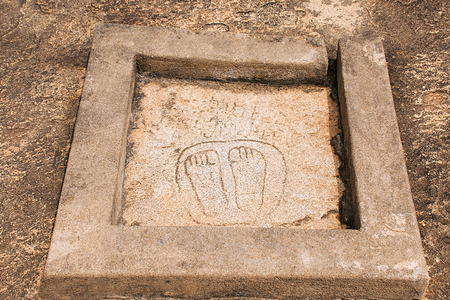 A pair of foot prints near Chavundaraya Basadi, Chandragiri hill temple complex, Sravanabelgola, Karnataka, Indiaの写真素材