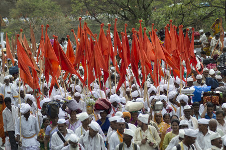 PUNE, MAHARASHTRA, INDIA, July 2016, Pilgrims or warkari with saffron flags during Pandarpur yatra...