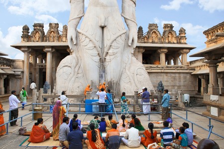 SRAVANABELGOLA, KARNATAKA, MAY 2016, Tourist and devotees at a gigiantic monolithic statue of Bahubali at Vindhyagiri Hillのeditorial素材