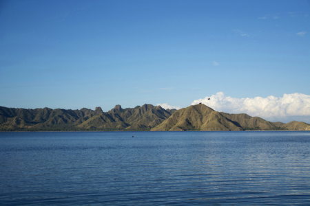 A seascape with mountains and clouds in a Indonesiaの写真素材