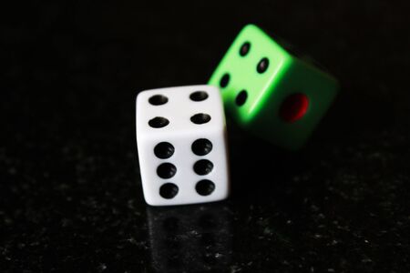 Two dice on a black background, game playの写真素材