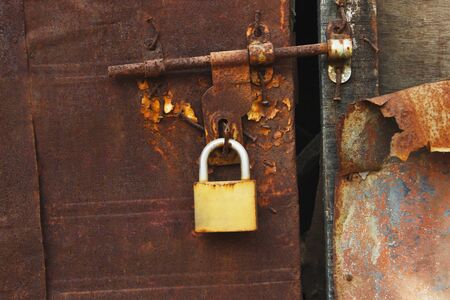 Close view of rusted door with lockの写真素材