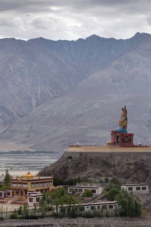 Long shot of Maitreya Buddha at Diskit Monastery, Nubra Valley, Ladakh, Jammu and Kashmir, India.の写真素材