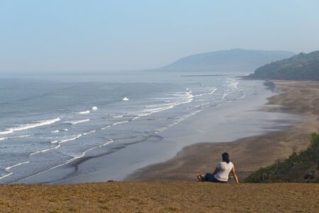 RAIGAD, MAHARASHTRA, INDIA, May 2015, Woman sitting at Friends Point, Anjarleのeditorial素材