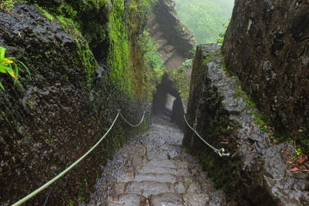 Top view of entrance gate of the fort during rain, Tikona Fort, Pune, Maharashtra, India.