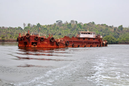 Barge carrying iron ore on Mandovi river, Goaの写真素材